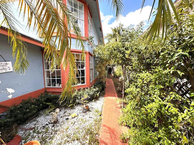 5473 E Berry Blossom Way E, West Palm Beach, FL 33415 - view of side of property with stucco siding