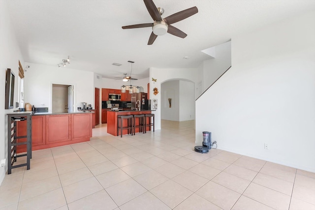 3769 Pebblebrook Ct, Coconut Creek, FL 33073 - living room with a ceiling fan and arched walkways