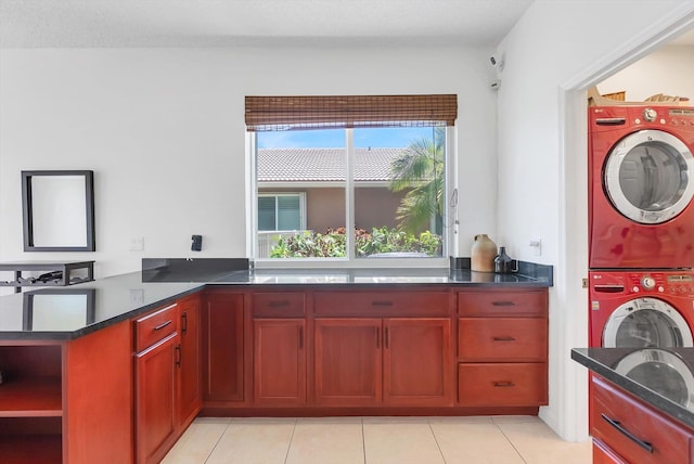 3769 Pebblebrook Ct, Coconut Creek, FL 33073 - laundry room featuring estacked washer and dryer and light tile patterned floors
