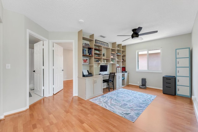 3769 Pebblebrook Ct, Coconut Creek, FL 33073 - office space featuring light wood finished floors, ceiling fan, baseboards, and a textured ceiling