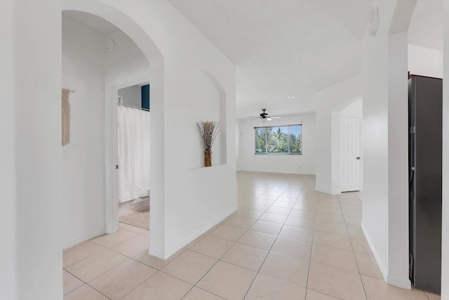 3769 Pebblebrook Ct, Coconut Creek, FL 33073 - hall with light tile patterned flooring and arched walkways