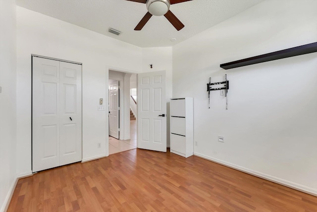 3769 Pebblebrook Ct, Coconut Creek, FL 33073 - unfurnished bedroom featuring light wood-style floors, baseboards, a closet, and a ceiling fan