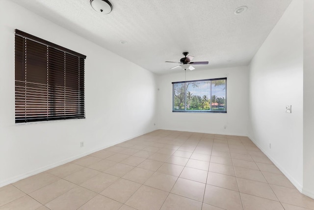 3769 Pebblebrook Ct, Coconut Creek, FL 33073 - unfurnished room featuring a ceiling fan, a textured ceiling, and light tile patterned floors