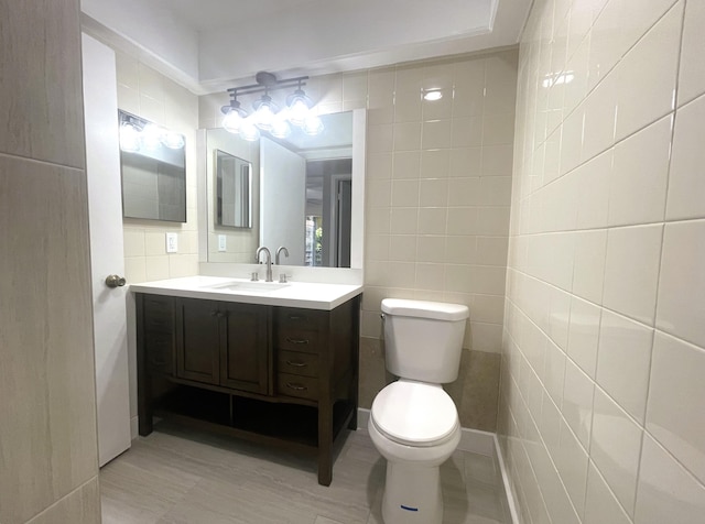 222 Piedmont E, Delray Beach, FL 33484 - bathroom featuring tile walls, vanity, and toilet