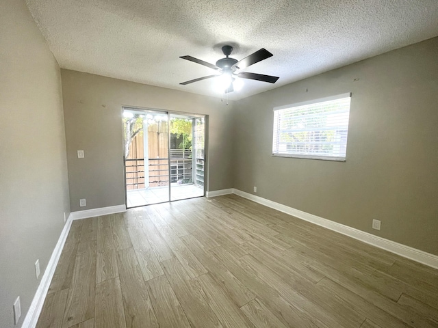 222 Piedmont E, Delray Beach, FL 33484 - spare room with wood finished floors, a textured ceiling, ceiling fan, and baseboards