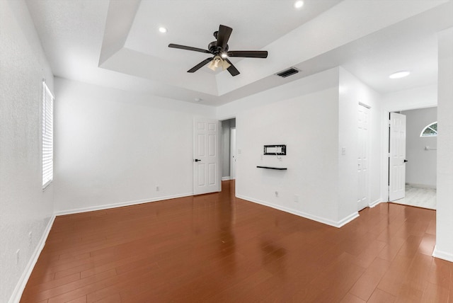 5814 Eagle Cay Ln, Coconut Creek, FL 33073 - unfurnished room featuring a tray ceiling, ceiling fan, wood finished floors, baseboards, and recessed lighting