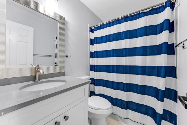 5814 Eagle Cay Ln, Coconut Creek, FL 33073 - bathroom featuring toilet, vanity, tile patterned flooring, and curtained shower