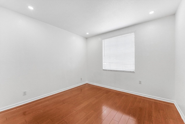 5814 Eagle Cay Ln, Coconut Creek, FL 33073 - unfurnished room featuring wood finished floors, baseboards, and recessed lighting