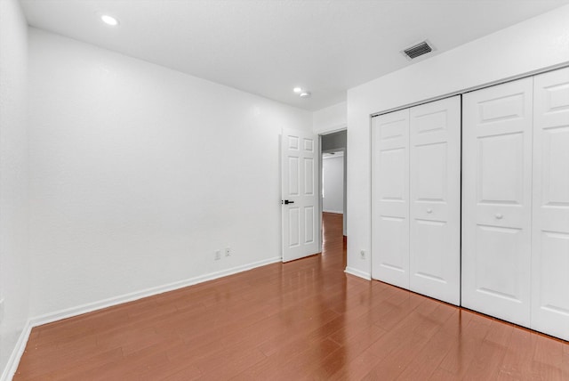 5814 Eagle Cay Ln, Coconut Creek, FL 33073 - unfurnished bedroom featuring light wood-type flooring, baseboards, a closet, and recessed lighting