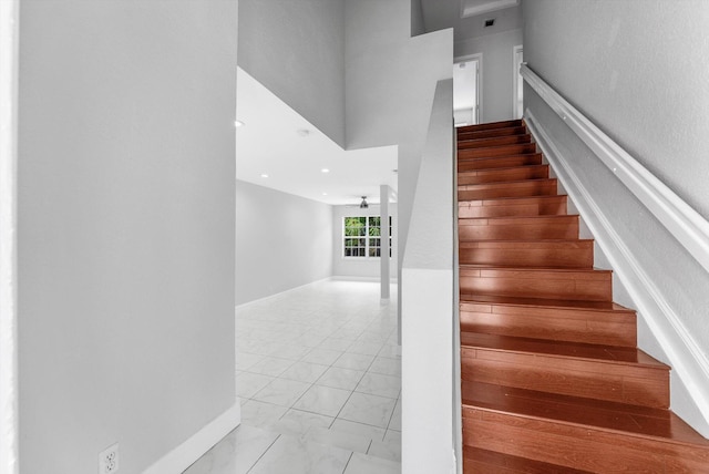 5814 Eagle Cay Ln, Coconut Creek, FL 33073 - stairway with baseboards, a high ceiling, a ceiling fan, and marble finish floors