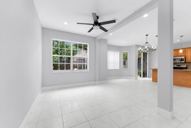 5814 Eagle Cay Ln, Coconut Creek, FL 33073 - unfurnished living room featuring plenty of natural light, a chandelier, ceiling fan, baseboards, and recessed lighting