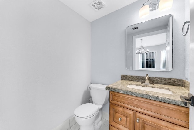 5814 Eagle Cay Ln, Coconut Creek, FL 33073 - half bath with toilet, vanity, a chandelier, and baseboards