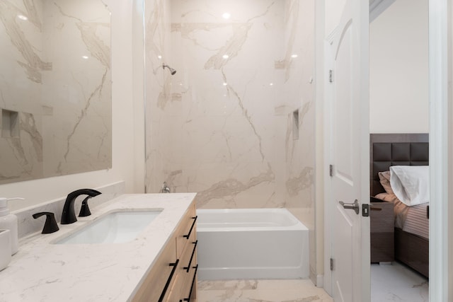 1783 SW Erie St, Port Saint Lucie, FL 34953 - ensuite bathroom featuring marble look tiles, vanity, and  shower combination
