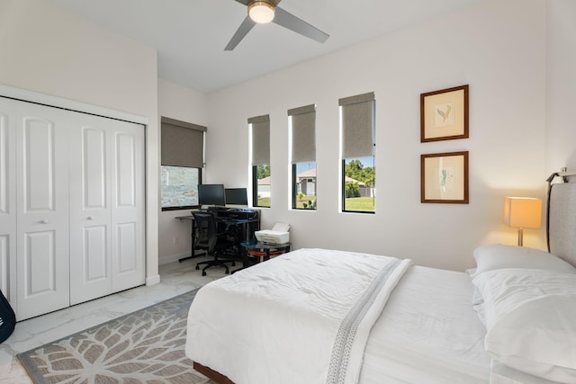 1783 SW Erie St, Port Saint Lucie, FL 34953 - bedroom with light marble finish flooring, a closet, a desk, and ceiling fan