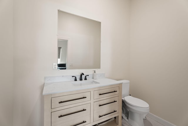 1783 SW Erie St, Port Saint Lucie, FL 34953 - bathroom featuring vanity, toilet, and baseboards