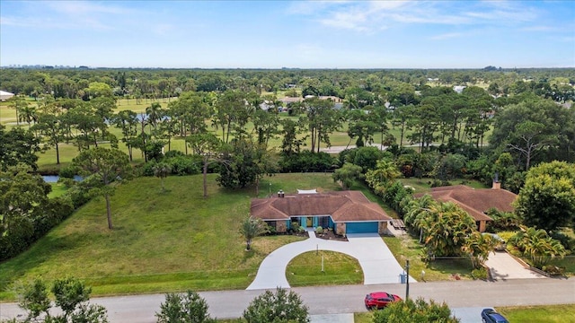 5706 Eagle Dr, Fort Pierce, FL 34950 - view of subject property with a tree filled landscape