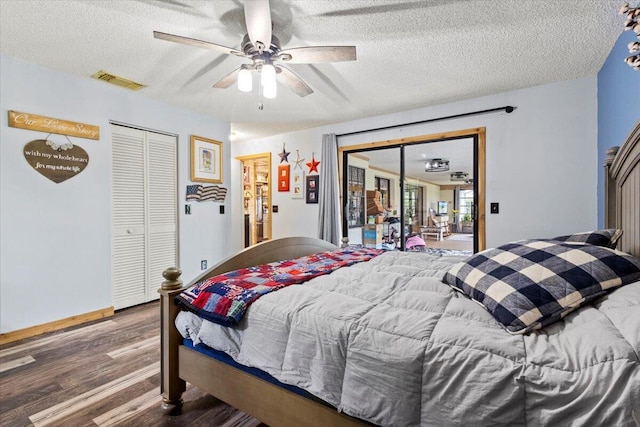 5706 Eagle Dr, Fort Pierce, FL 34950 - bedroom with wood finished floors, a textured ceiling, ceiling fan, baseboards, and access to exterior