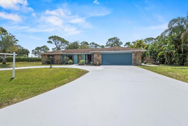 5706 Eagle Dr, Fort Pierce, FL 34950 - single story home featuring curved driveway, an attached garage, and a front lawn