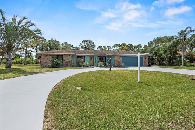5706 Eagle Dr, Fort Pierce, FL 34950 - ranch-style house with curved driveway, a front lawn, and an attached garage