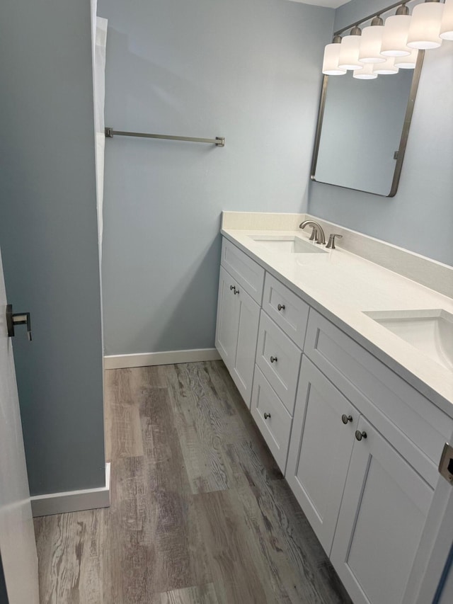 3611 SW Sunset Trace Cir, Palm City, FL 34990 - bathroom with double vanity and wood finished floors