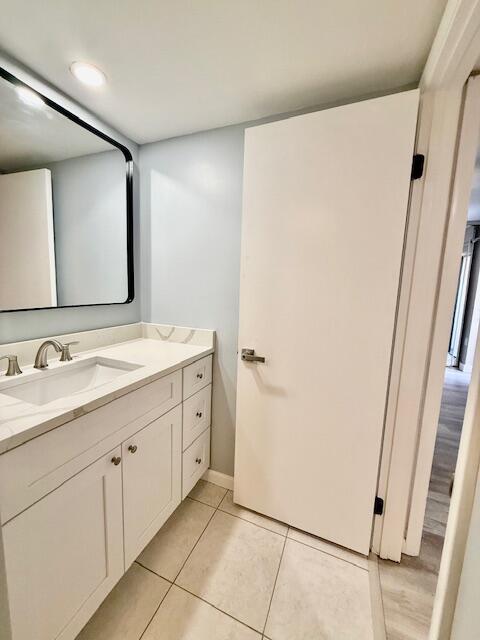 3611 SW Sunset Trace Cir, Palm City, FL 34990 - bathroom featuring vanity and tile patterned floors