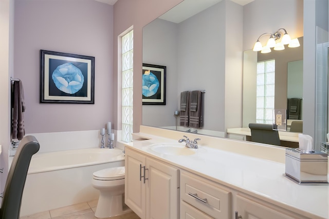 10581 SW Stratton Dr, Port Saint Lucie, FL 34987 - full bath featuring toilet, tile patterned floors, a bath, and vanity