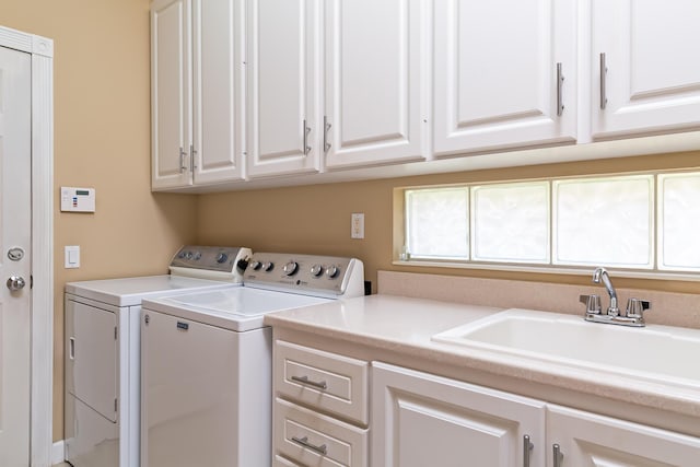 10581 SW Stratton Dr, Port Saint Lucie, FL 34987 - washroom featuring washer and clothes dryer and cabinet space