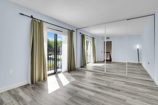 202 2nd Ct, Palm Beach Gardens, FL 33410 - spare room with wood finished floors and baseboards