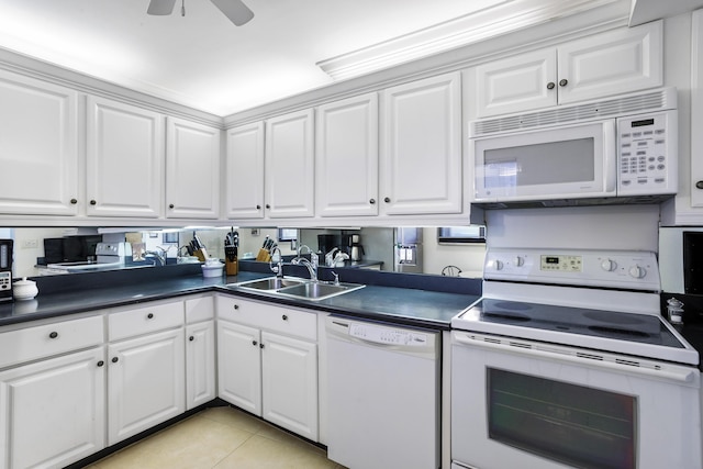 200 Ocean Trail Way Unit 106, Jupiter, FL 33477 - kitchen with white appliances, dark countertops, a sink, light tile patterned floors, and white cabinetry