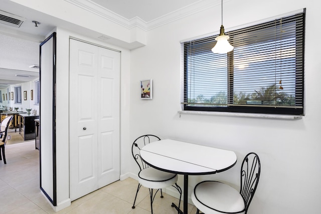 200 Ocean Trail Way Unit 106, Jupiter, FL 33477 - dining space featuring light tile patterned floors, ornamental molding, and baseboards