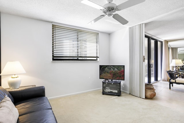 200 Ocean Trail Way Unit 106, Jupiter, FL 33477 - living area featuring ceiling fan, carpet flooring, a textured ceiling, and baseboards