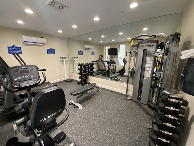 200 Ocean Trail Way Unit 106, Jupiter, FL 33477 - gym featuring an AC wall unit, recessed lighting, and baseboards