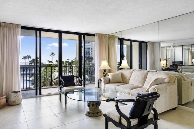 200 Ocean Trail Way Unit 106, Jupiter, FL 33477 - tiled living room with floor to ceiling windows, plenty of natural light, and a textured ceiling