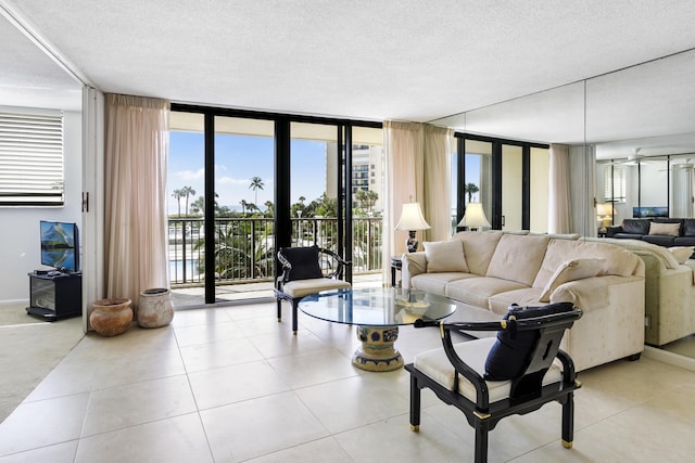 200 Ocean Trail Way Unit 106, Jupiter, FL 33477 - living area featuring floor to ceiling windows, a textured ceiling, and tile patterned flooring