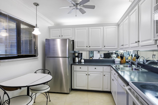 200 Ocean Trail Way Unit 106, Jupiter, FL 33477 - kitchen with freestanding refrigerator, a sink, dishwasher, white cabinets, and crown molding