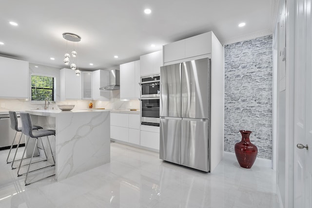 7678 Courtyard Run W, Boca Raton, FL 33433 - kitchen featuring stainless steel appliances, wall chimney exhaust hood, modern cabinets, white cabinetry, and recessed lighting