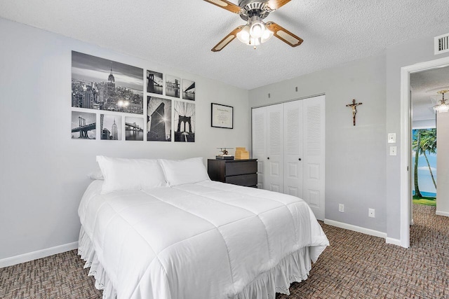 7678 Courtyard Run W, Boca Raton, FL 33433 - bedroom with a closet, a textured ceiling, carpet floors, baseboards, and a ceiling fan