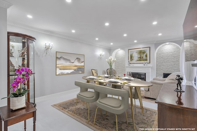 7678 Courtyard Run W, Boca Raton, FL 33433 - dining room featuring a glass covered fireplace, recessed lighting, ornamental molding, and baseboards