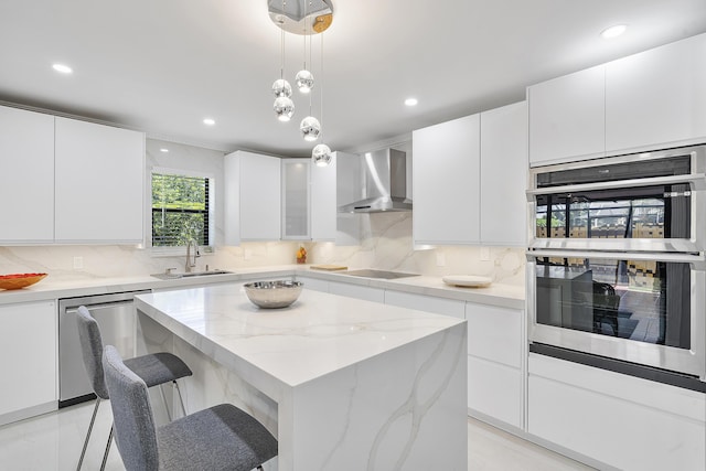 7678 Courtyard Run W, Boca Raton, FL 33433 - kitchen featuring wall chimney exhaust hood, stainless steel appliances, a sink, a kitchen island, and tasteful backsplash