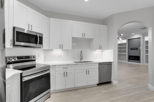 6365 Bella Cir Unit 705, Boynton Beach, FL 33437 - kitchen with stainless steel appliances, a sink, white cabinetry, and recessed lighting