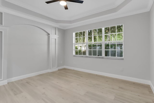 6365 Bella Cir Unit 705, Boynton Beach, FL 33437 - spare room with a tray ceiling, light wood finished floors, a ceiling fan, ornamental molding, and ornate columns