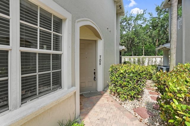 6365 Bella Cir Unit 705, Boynton Beach, FL 33437 - view of exterior entry featuring stucco siding