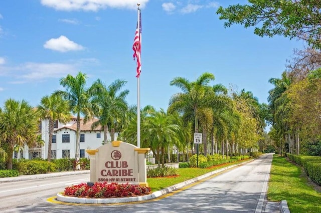 5590 NW 61st St Unit 815, Coconut Creek, FL 33073 - view of asphalt street with traffic signs and curbs