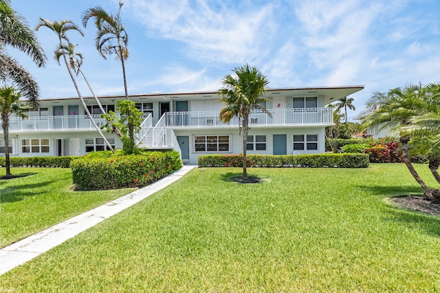 2430 S Federal Hwy Unit 10, Boynton Beach, FL 33435 - rear view of property with a lawn