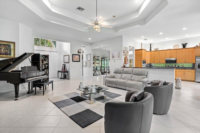 7208 Corning Cir, Boynton Beach, FL 33437 - living area with a tray ceiling, light tile patterned floors, a ceiling fan, and recessed lighting