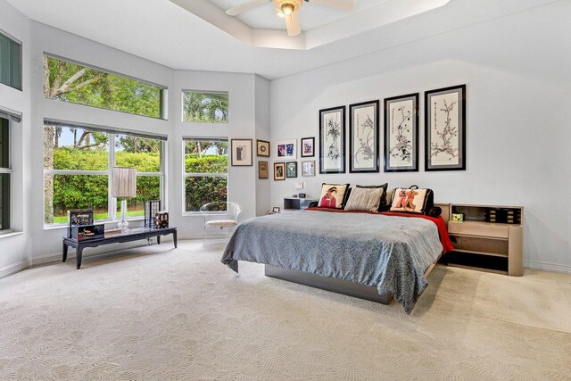 7208 Corning Cir, Boynton Beach, FL 33437 - carpeted bedroom with a towering ceiling, baseboards, and ceiling fan