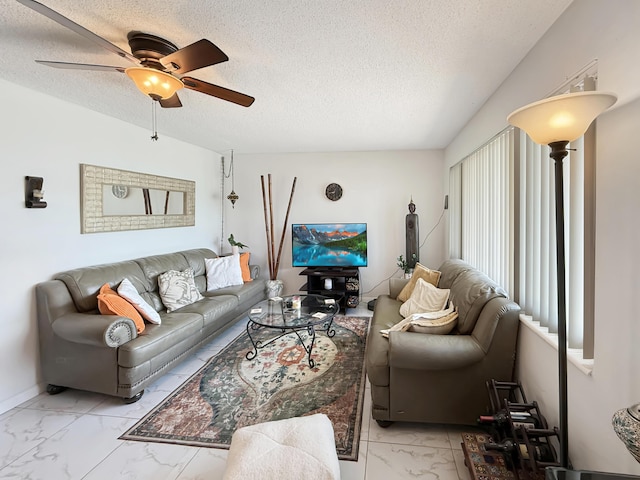 8650 NW 29th St, Sunrise, FL 33322 - living room featuring light marble finish flooring, a ceiling fan, and a textured ceiling