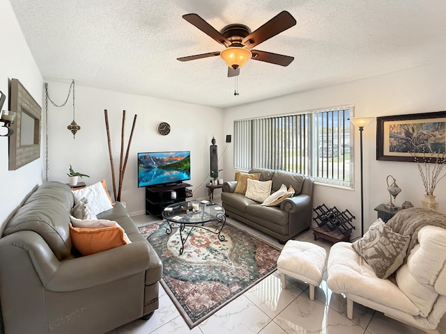 8650 NW 29th St, Sunrise, FL 33322 - living room featuring marble look tile flooring, ceiling fan, and a textured ceiling