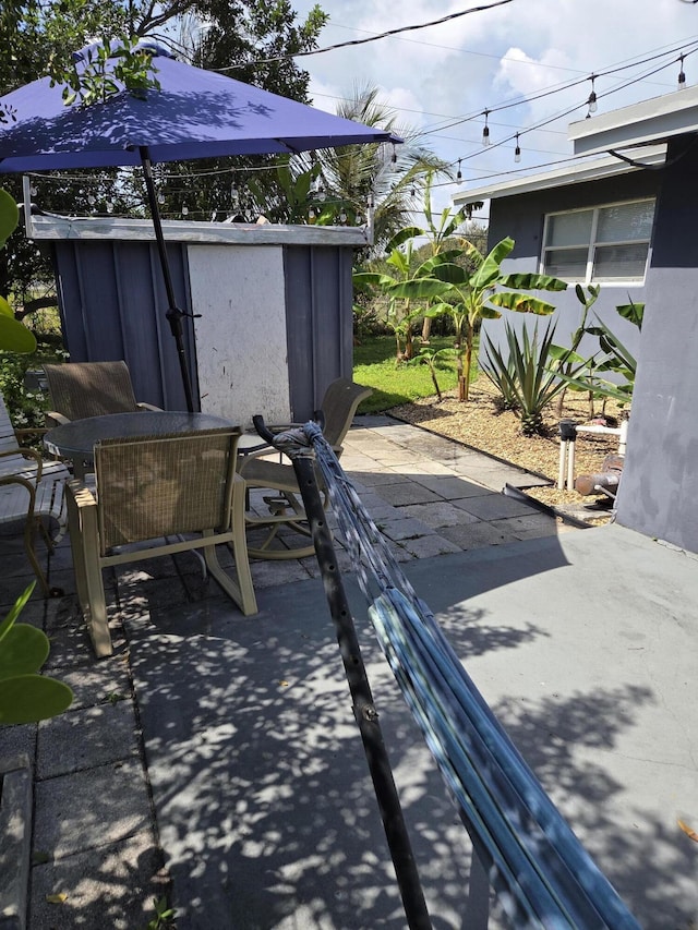152 NW 14th Ave, Boynton Beach, FL 33435 - view of patio featuring outdoor dining area