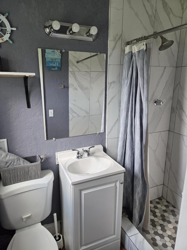 152 NW 14th Ave, Boynton Beach, FL 33435 - bathroom with vanity, a shower stall, toilet, and a textured wall